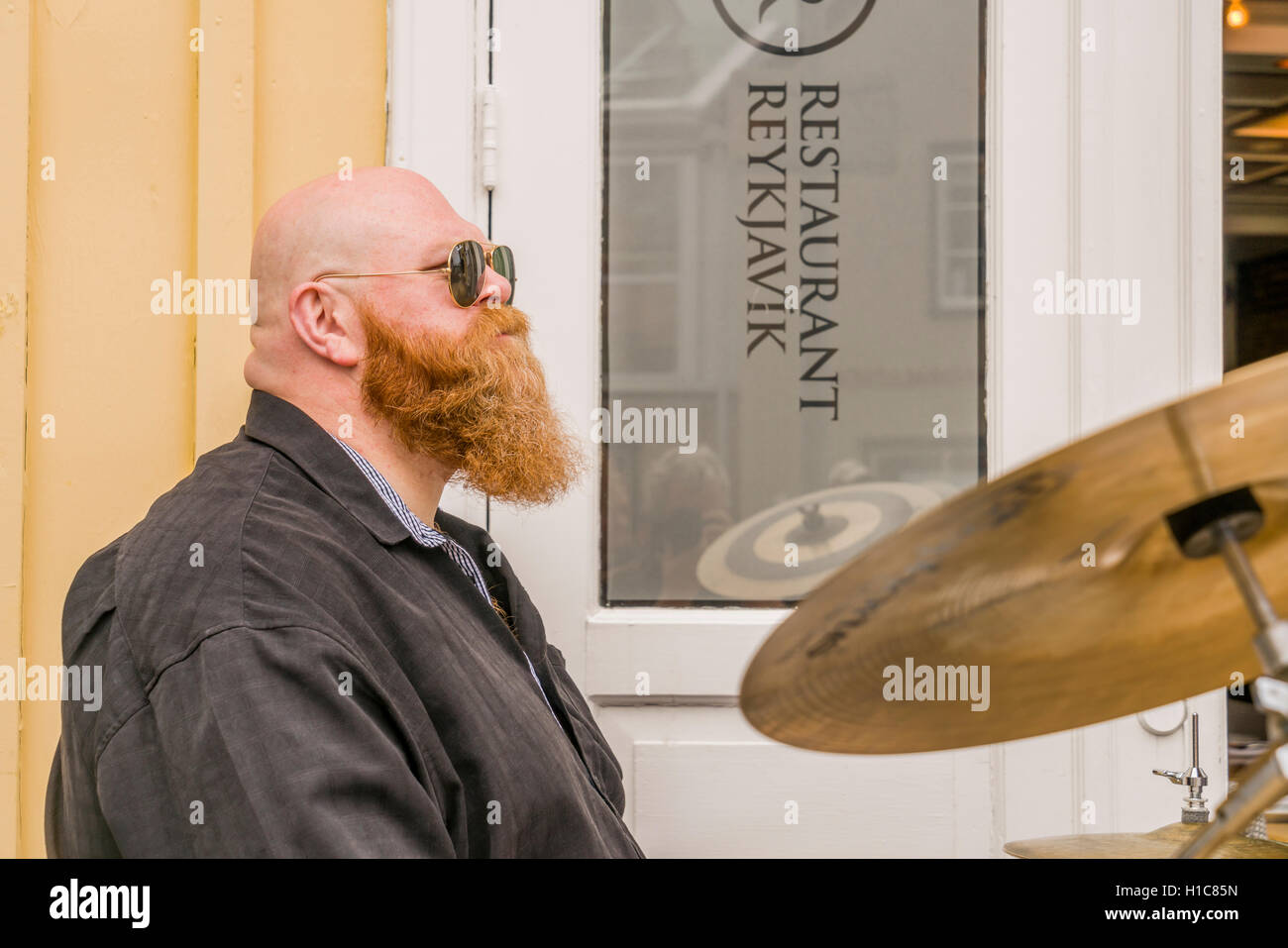Drummer playing outside during Menningarnott- The Cultural Festival in Reykjavik, Iceland Stock Photo