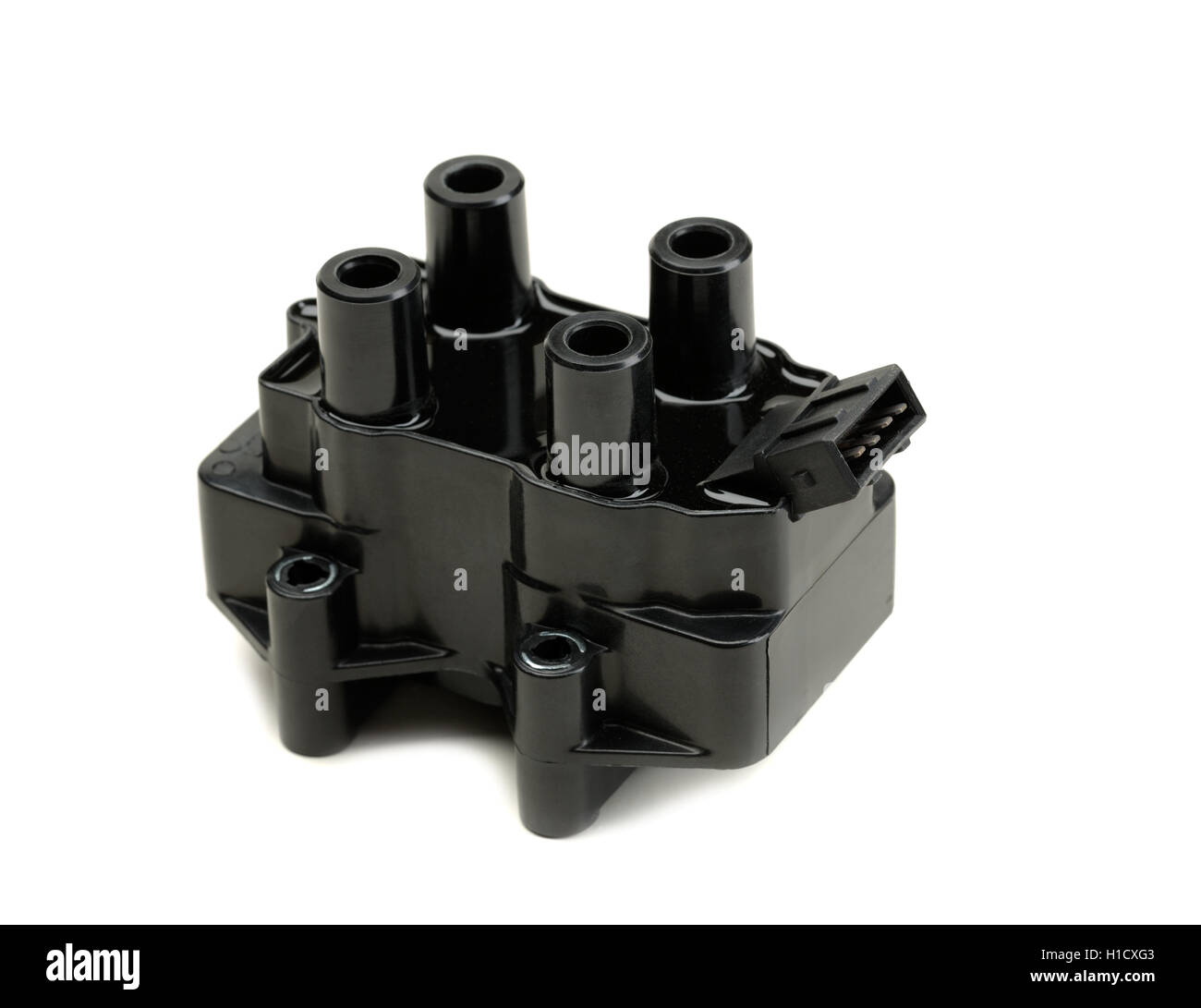 Ignition coil for gasoline four-cylinder internal combustion engine. Isolate on white. Stock Photo