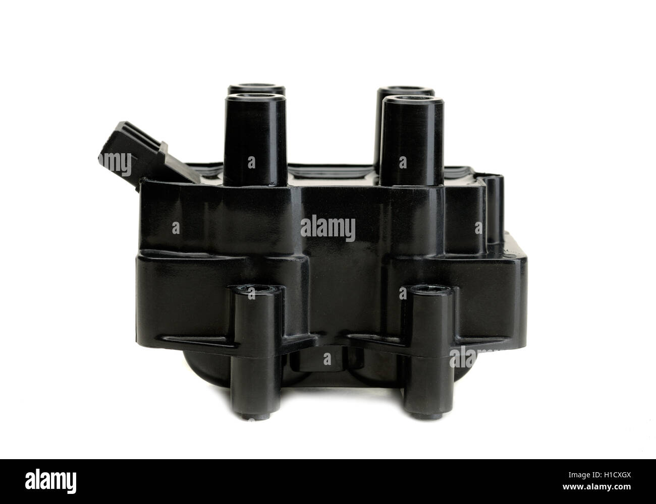 Ignition coil for gasoline four-cylinder internal combustion engine. Side view. Isolate on white. Stock Photo