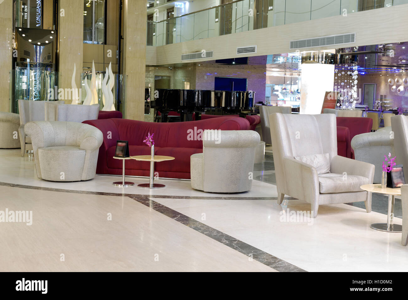 Hall Hotel, sofas, armchairs and piano black. Stock Photo