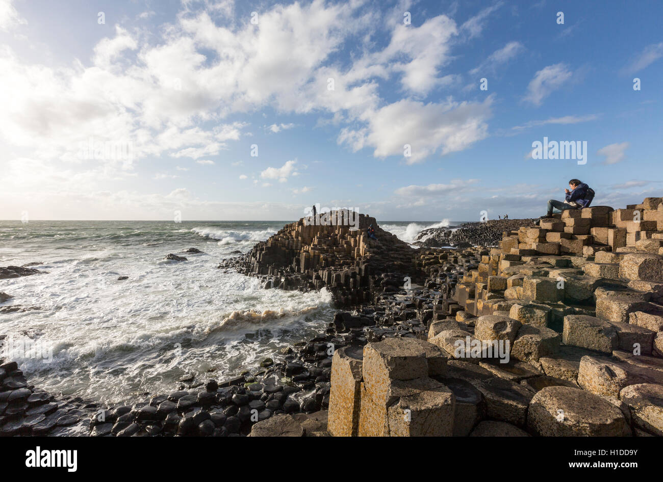 Tourists at Giant's Causeway, Bushmills, County Antrim, Northern Ireland, UK Stock Photo