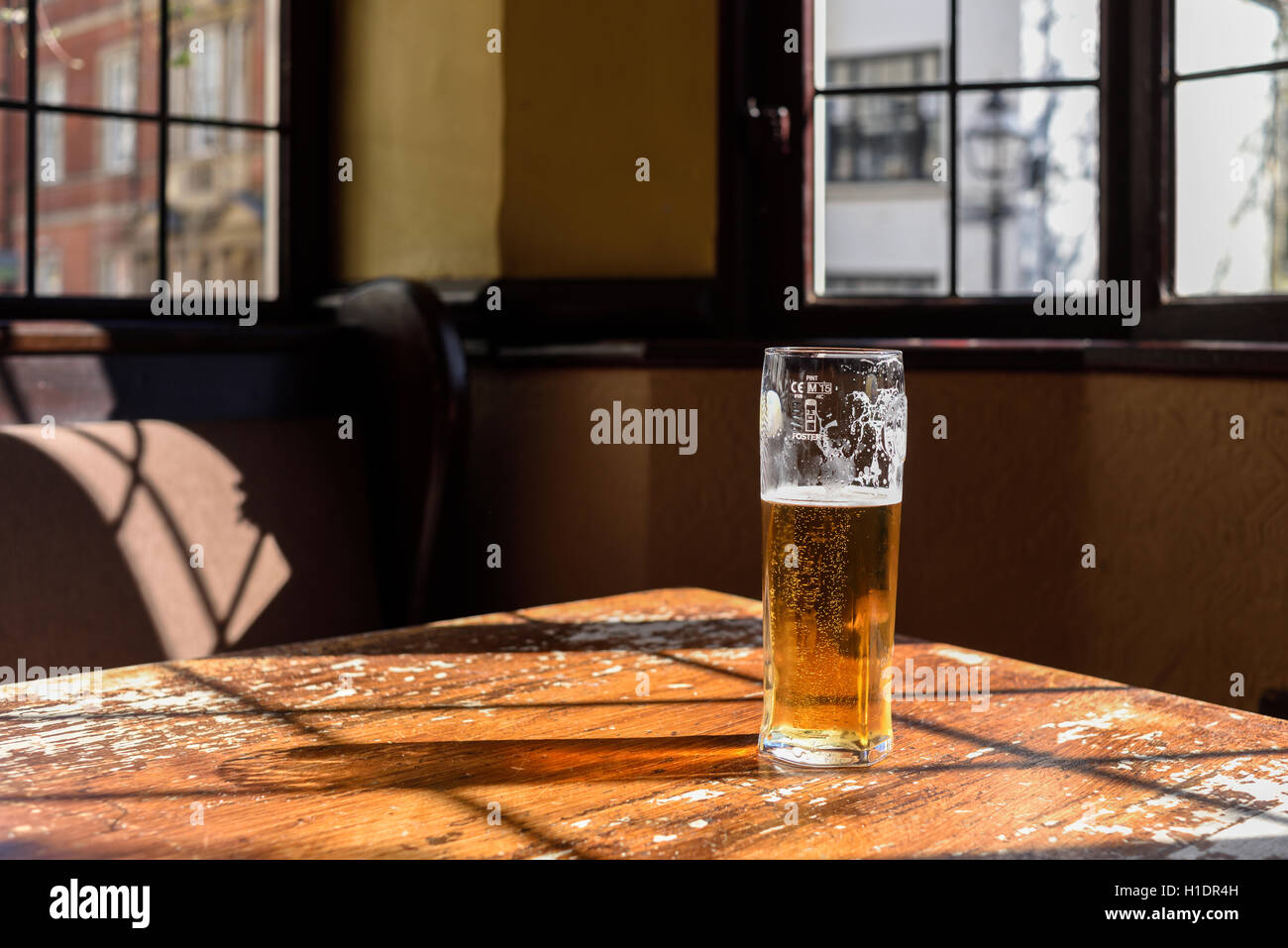 Half Full Glass Of Lager. Stock Photo