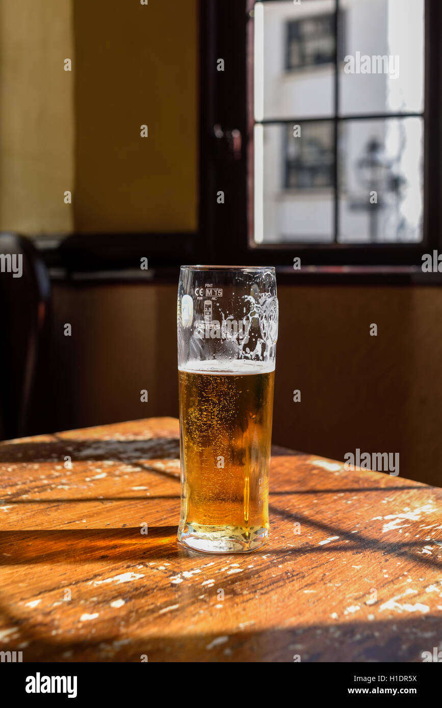 Half Full Glass Of Lager Stock Photo Alamy