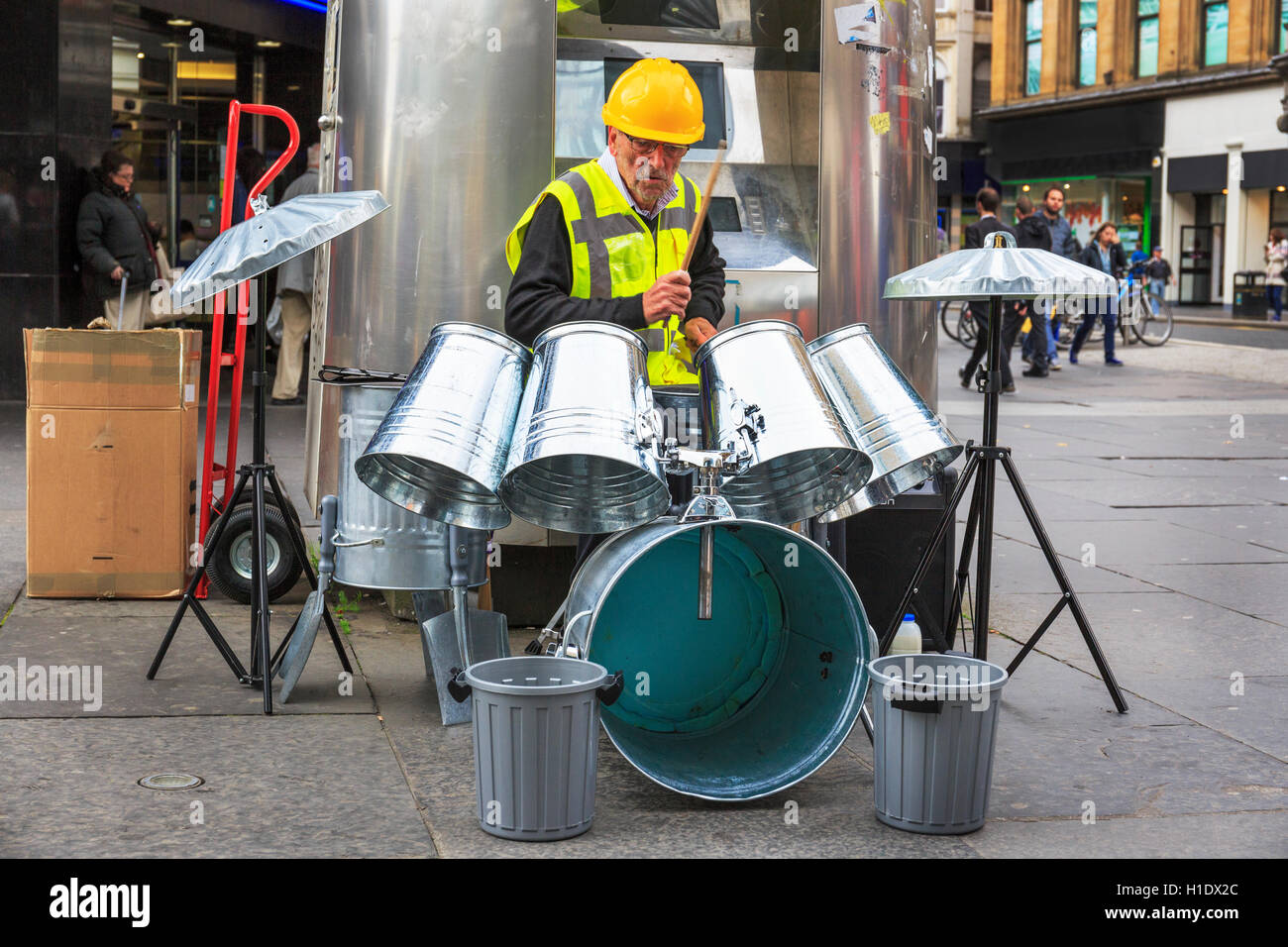 Busker playing in Glasgow, using dustbins as a set of drums, Glasgow
