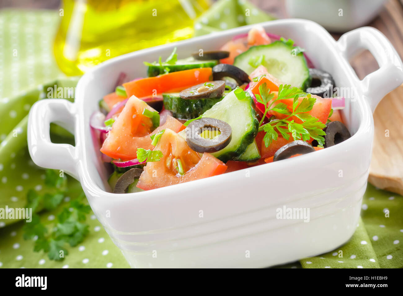 Salad with tomatoes and cucumbers Stock Photo - Alamy