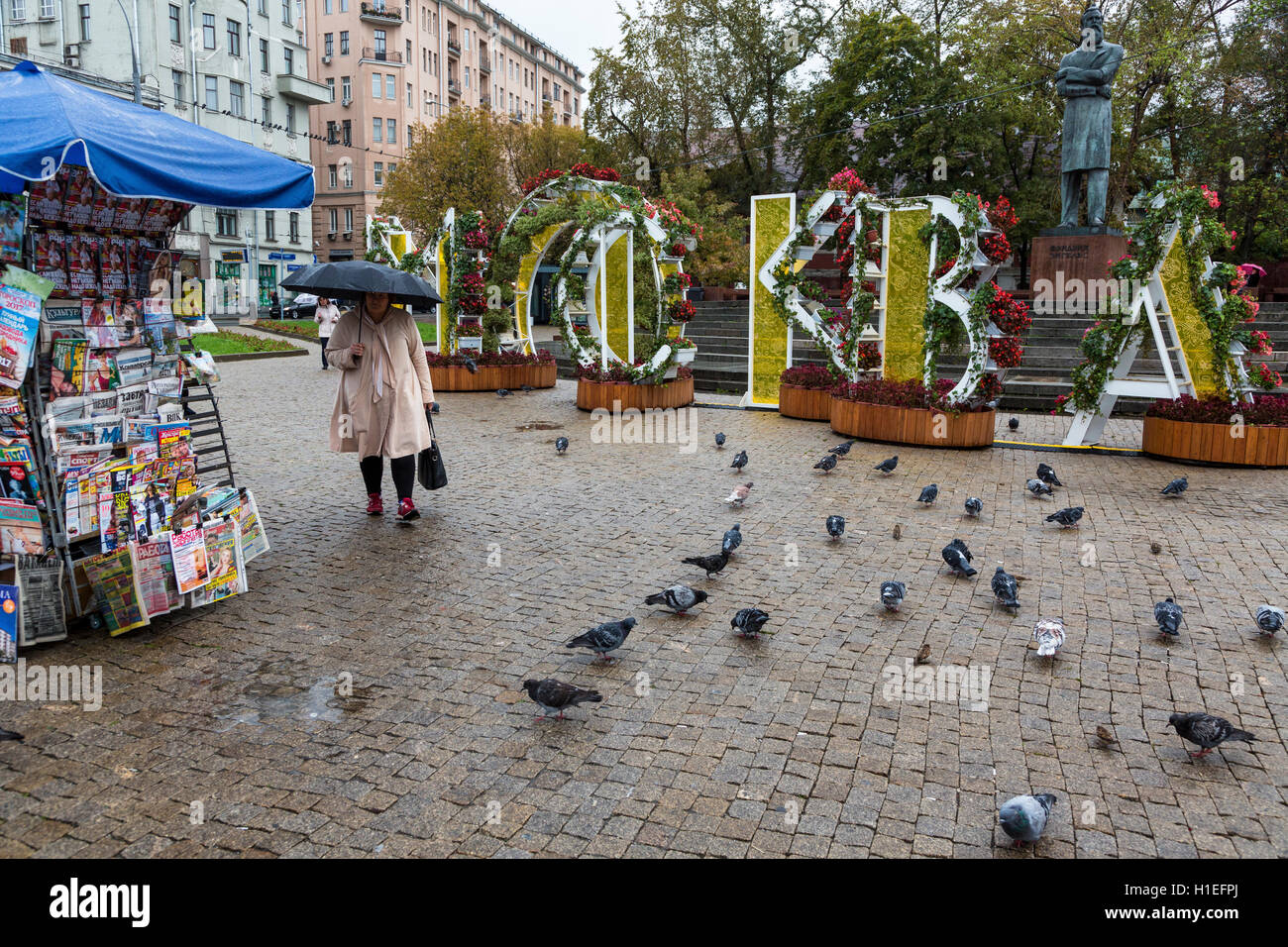 View of capital letters "Moscow" and a street newsstand on Prechistenskiye Vorota square of Moscow in the raining weather, Russia Stock Photo