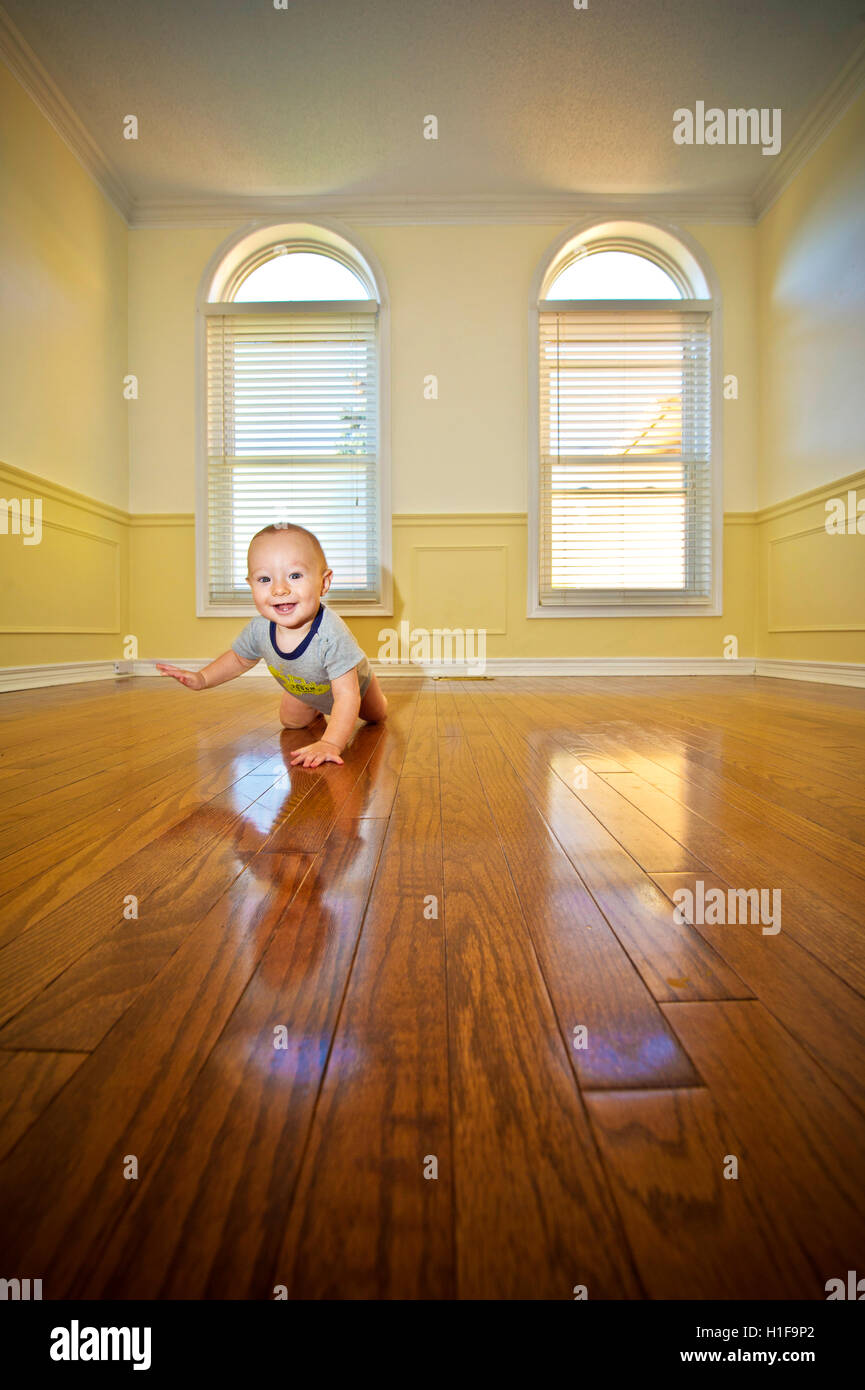 infant boy in an empty room Stock Photo - Alamy