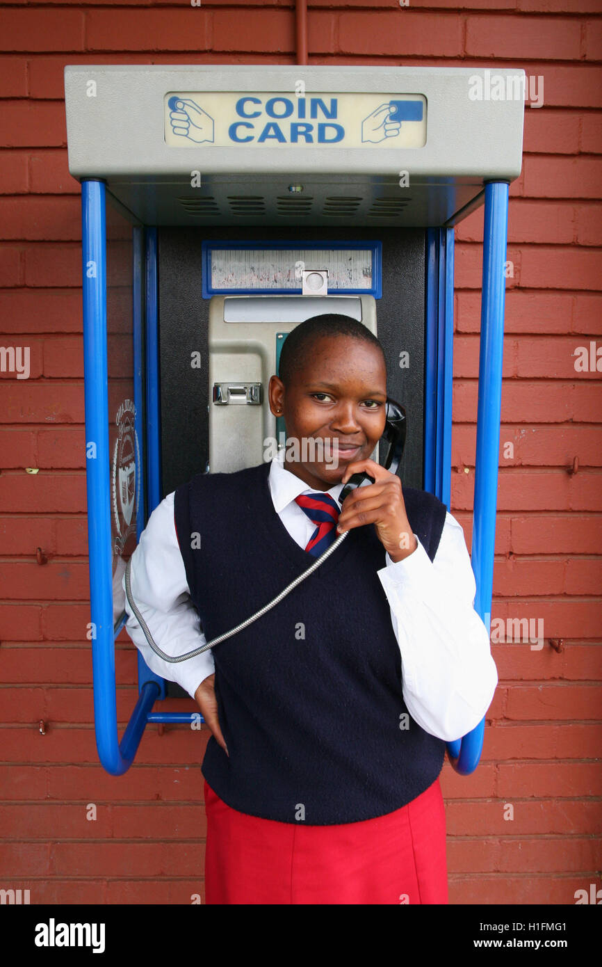 School girl using payphone, St Mark's School, Mbabane, Hhohho, Kingdom of Swaziland Stock Photo