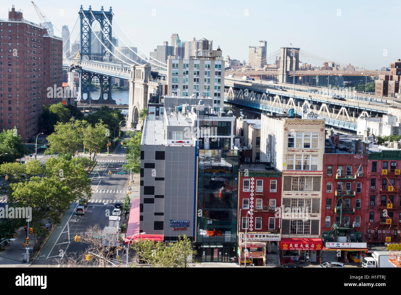 New York City,NY NYC,Lower Manhattan,Chinatown,East Broadway,skyline,building,Manhattan Bridge,Brooklyn Bridge,overhead view,street,East River water,v Stock Photo