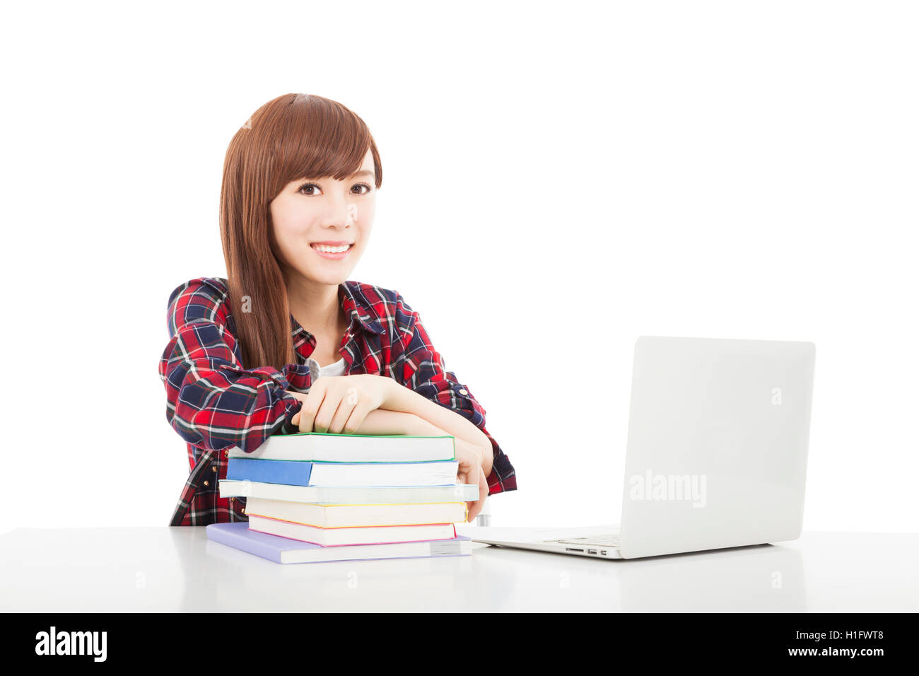 smiling young student girl with book and laptop isolated on whit Stock ...