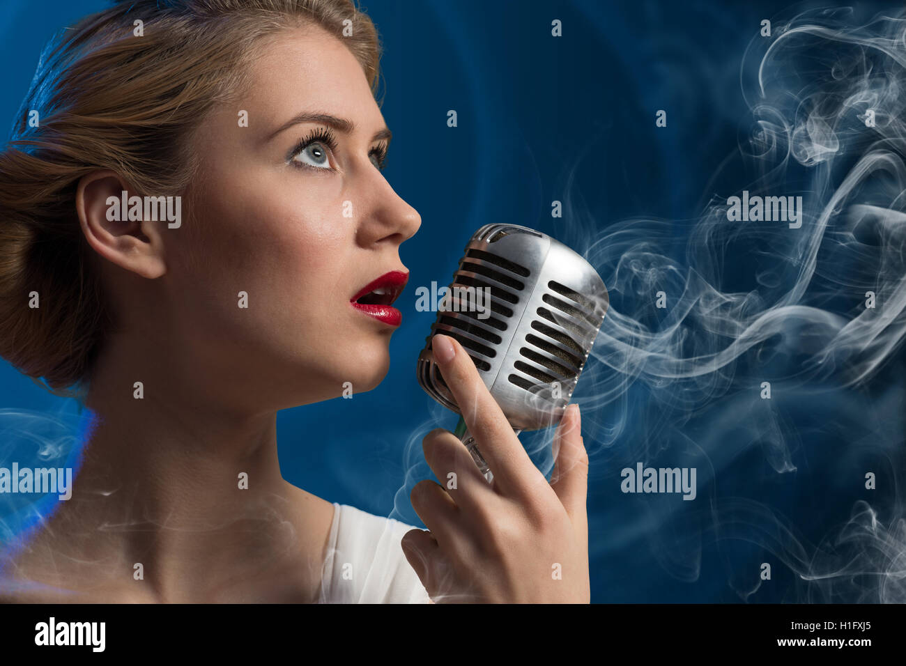 attractive-female-singer-with-microphone-stock-photo-alamy