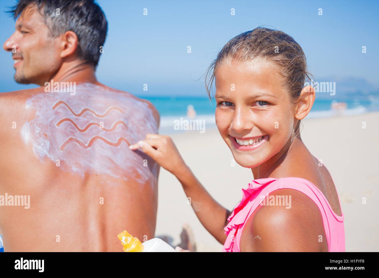 Applying sun cream Stock Photo Alamy