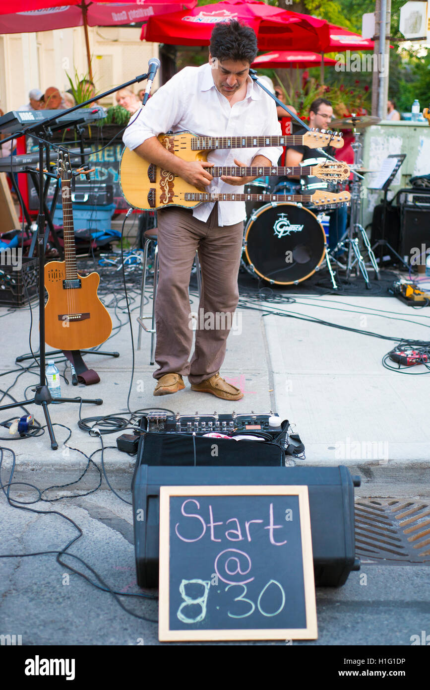 TORONTO, CANADA - AUGUST 22, 2015; Street performer during Toronto Jazz festival on Queen street east. Stock Photo