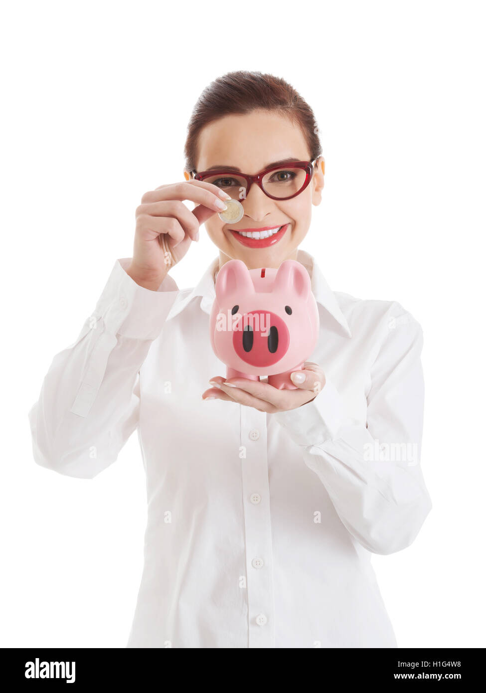 Beautiful business woman with coin and piggy- bank Stock Photo - Alamy