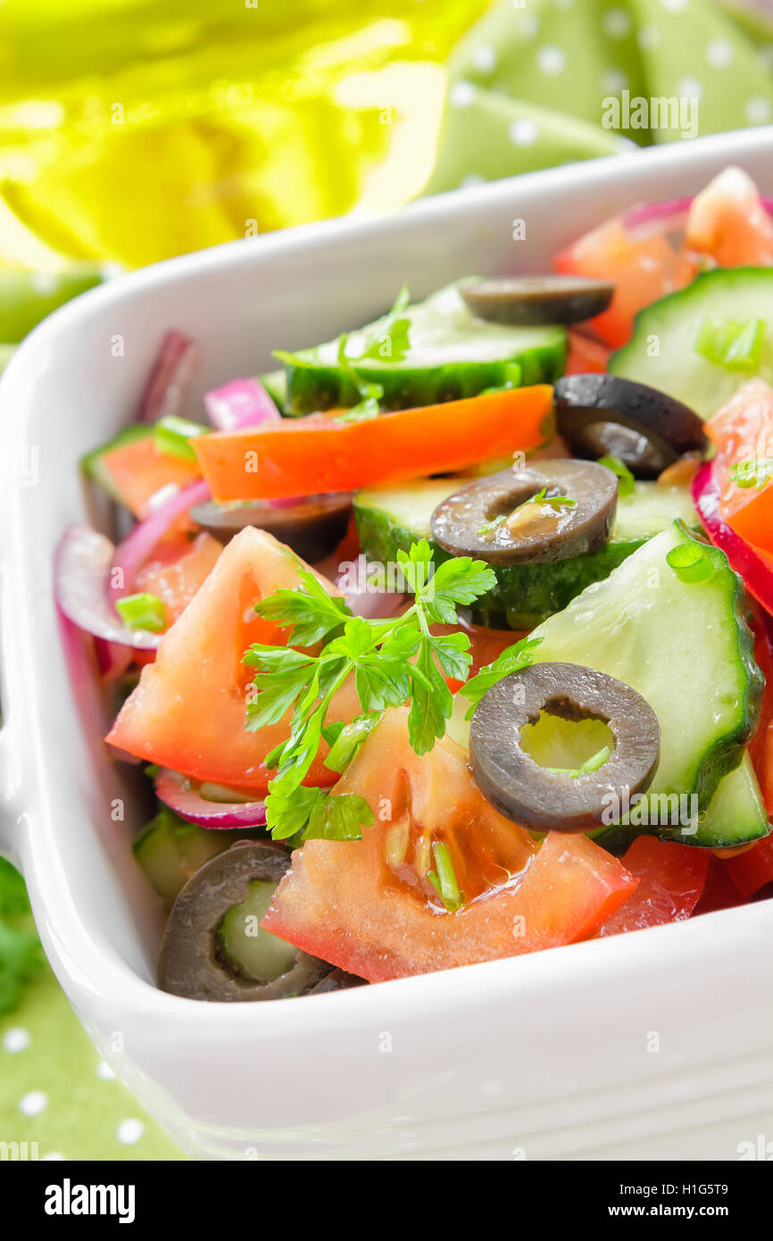 Salad with tomatoes and cucumbers Stock Photo - Alamy