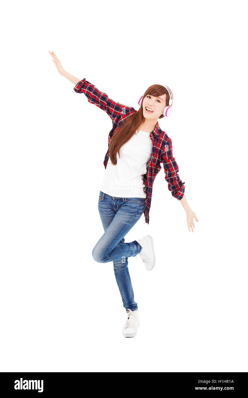 Young woman with headphones listening music and dancing Stock Photo - Alamy