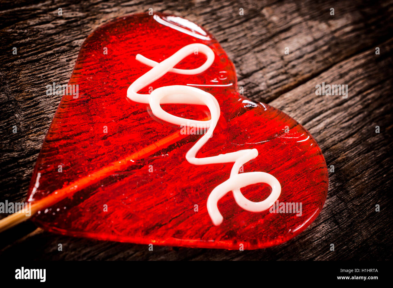 Single lolly pop on wooden table Stock Photo