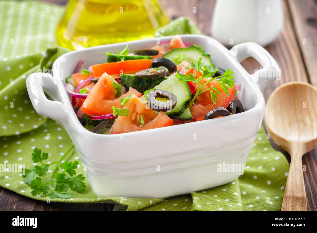 Salad with tomatoes and cucumbers Stock Photo - Alamy