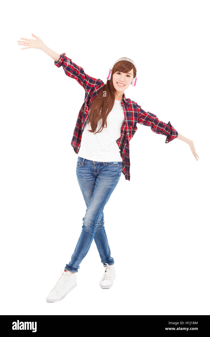 Young woman with headphones listening music and dancing Stock Photo - Alamy