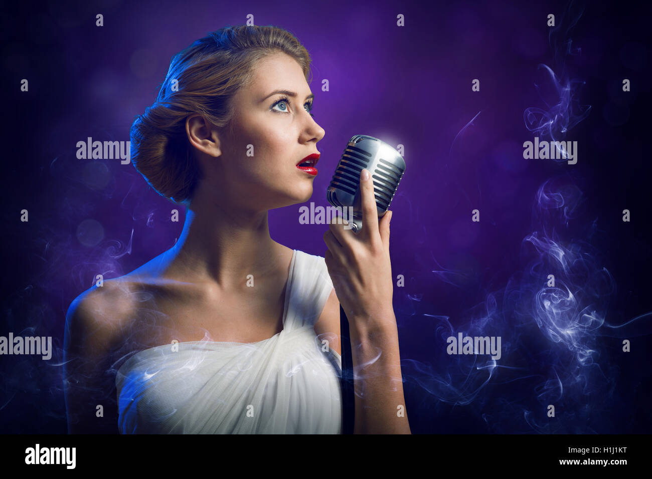 attractive-female-singer-with-microphone-stock-photo-alamy