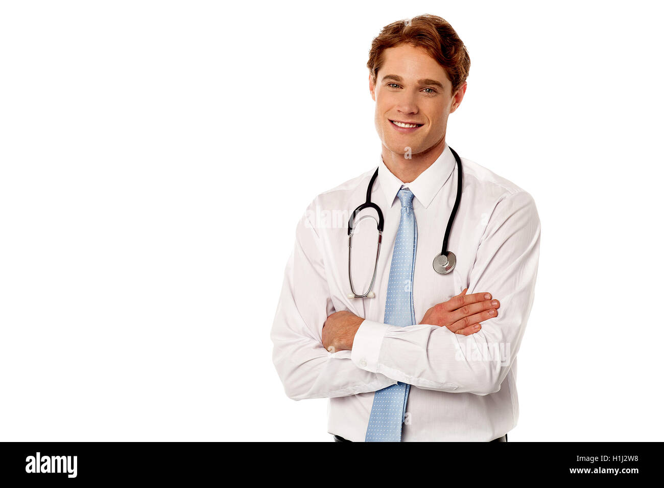Happy young doctor crossed arms hi-res stock photography and images - Alamy