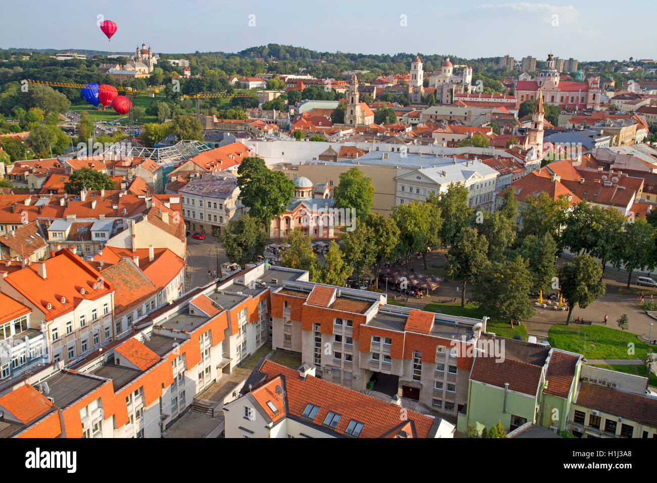 Hot air balloon flying over the old town of Vilnius Stock Photo
