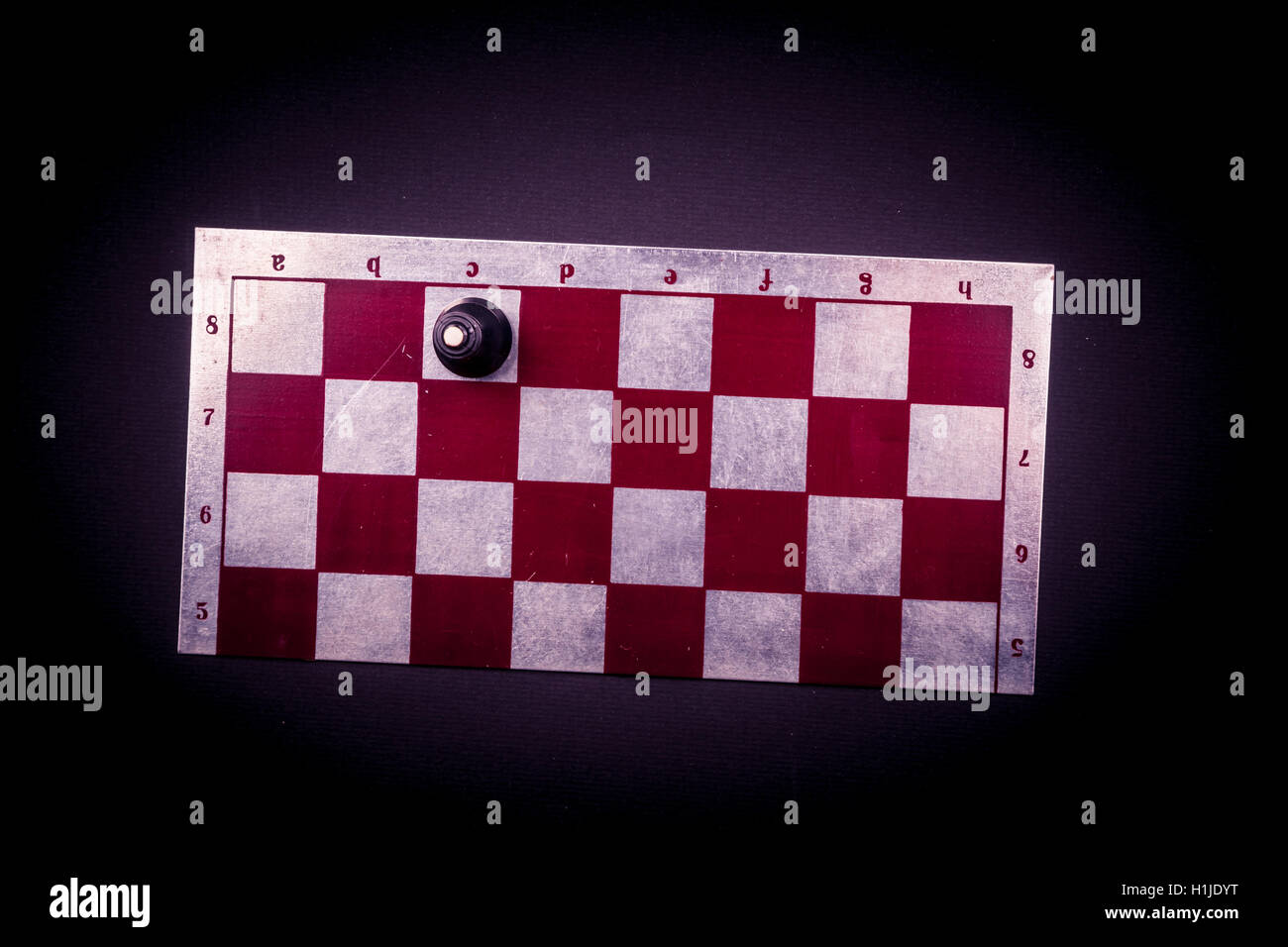 Chess board on dark background. Stock Photo