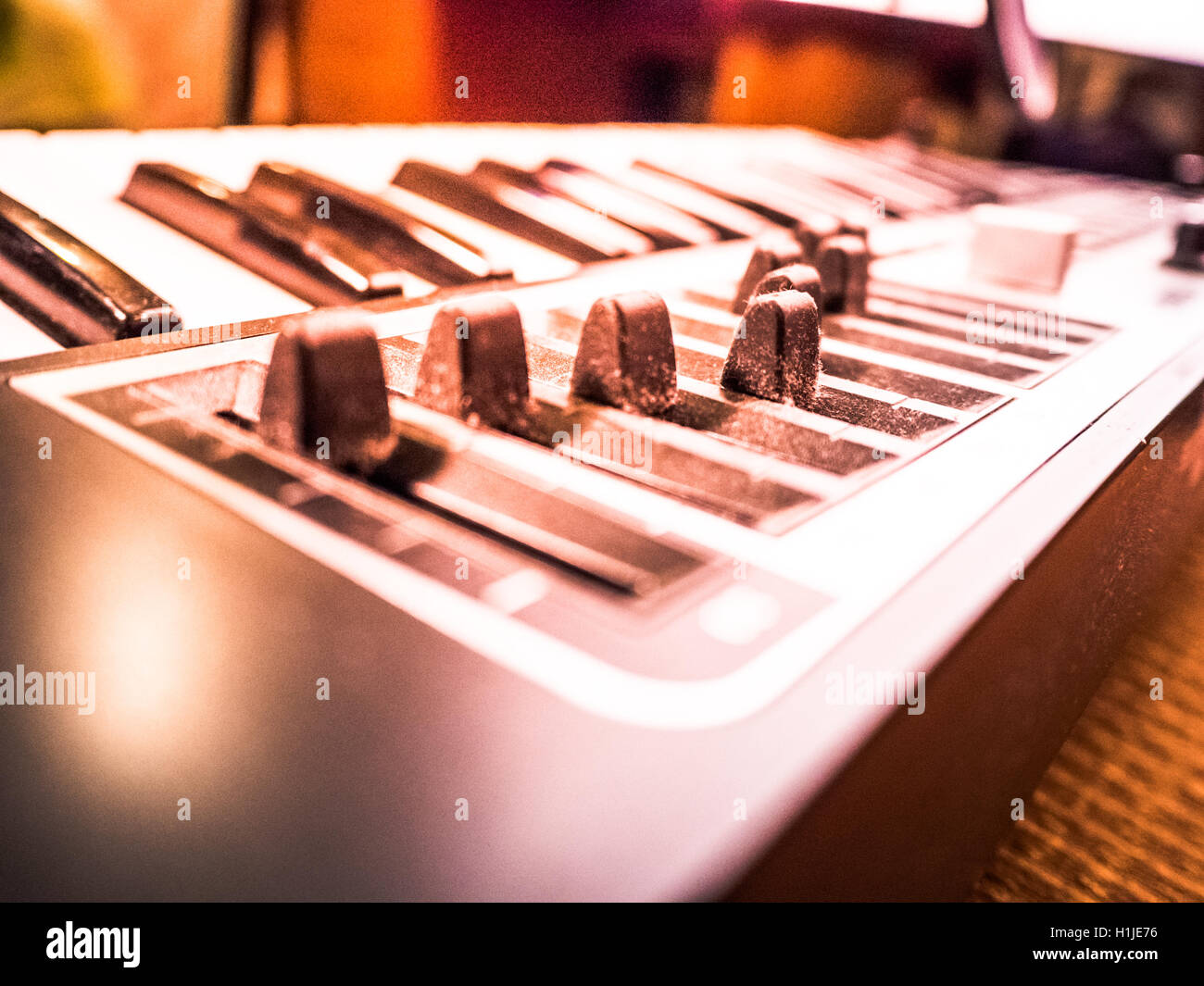Keyboard of a synthesizer with sliders Stock Photo - Alamy