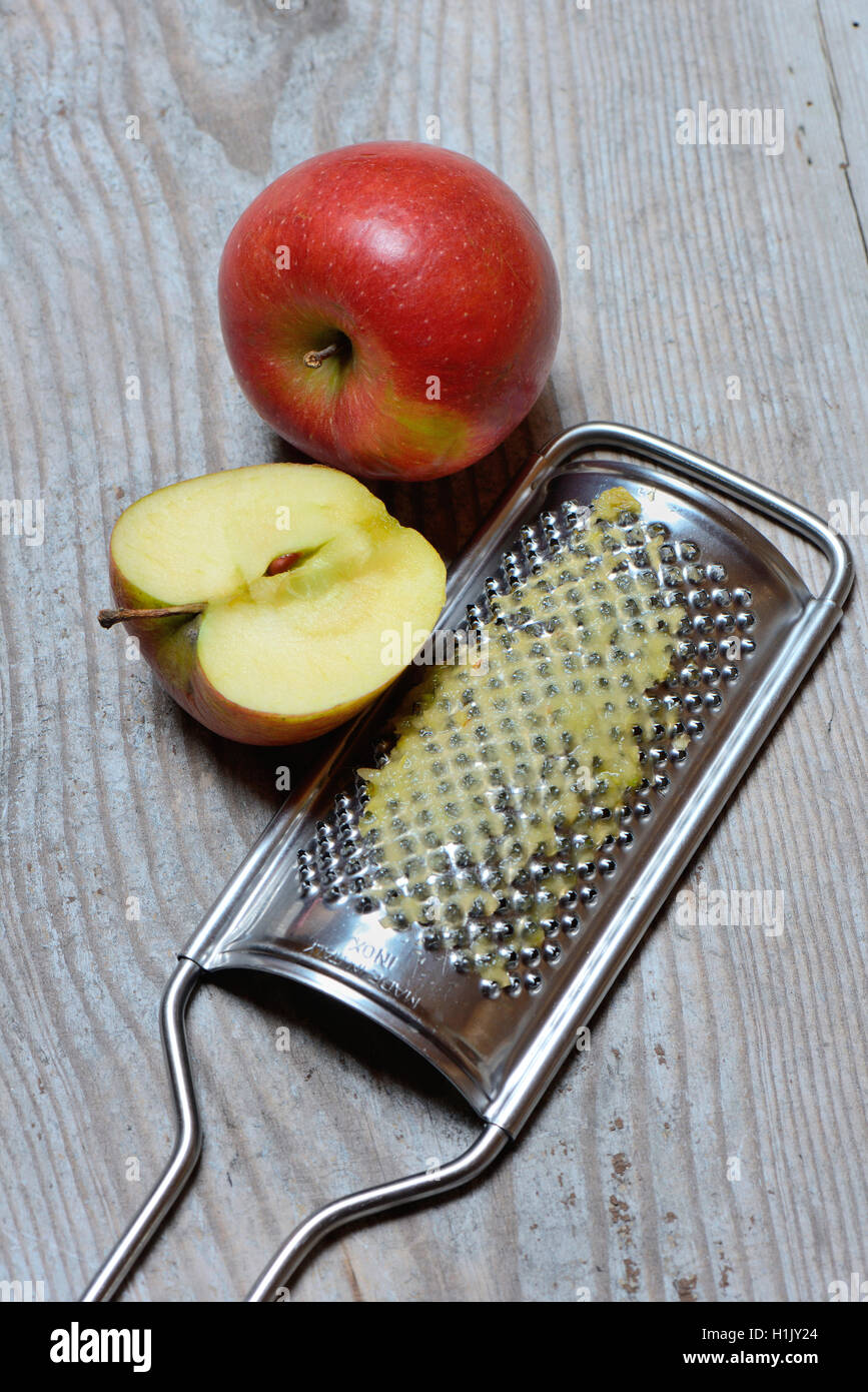 Apple and grater Stock Photo