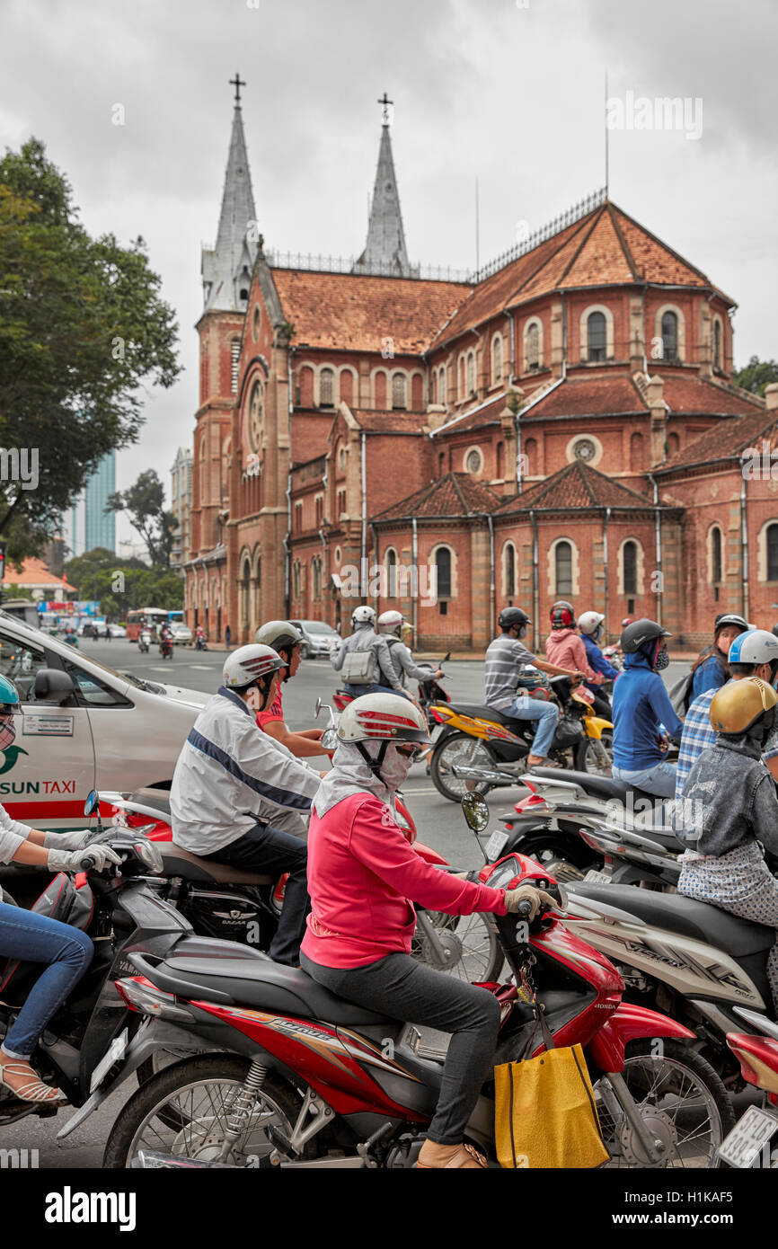 Road traffic near Saigon Notre-Dame Basilica. Ho Chi Minh City, Vietnam. Stock Photo