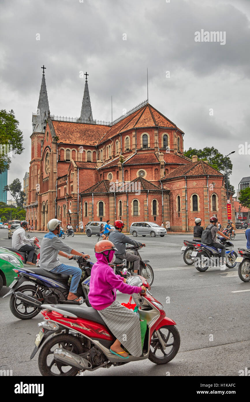 Road traffic near Saigon Notre-Dame Basilica. Ho Chi Minh City, Vietnam. Stock Photo