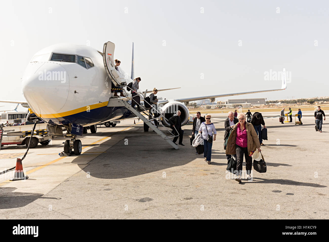 Passengers disembarking from a Ryanair flight on landing at Malta Stock Photo