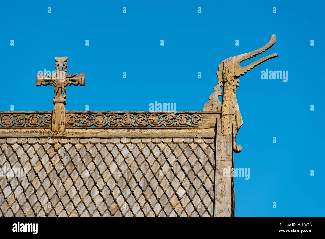 Roof detail with wood shingles, wooden cross and dragon head, Stave Church Lom, Lom, Oppland, Norway Stock Photo