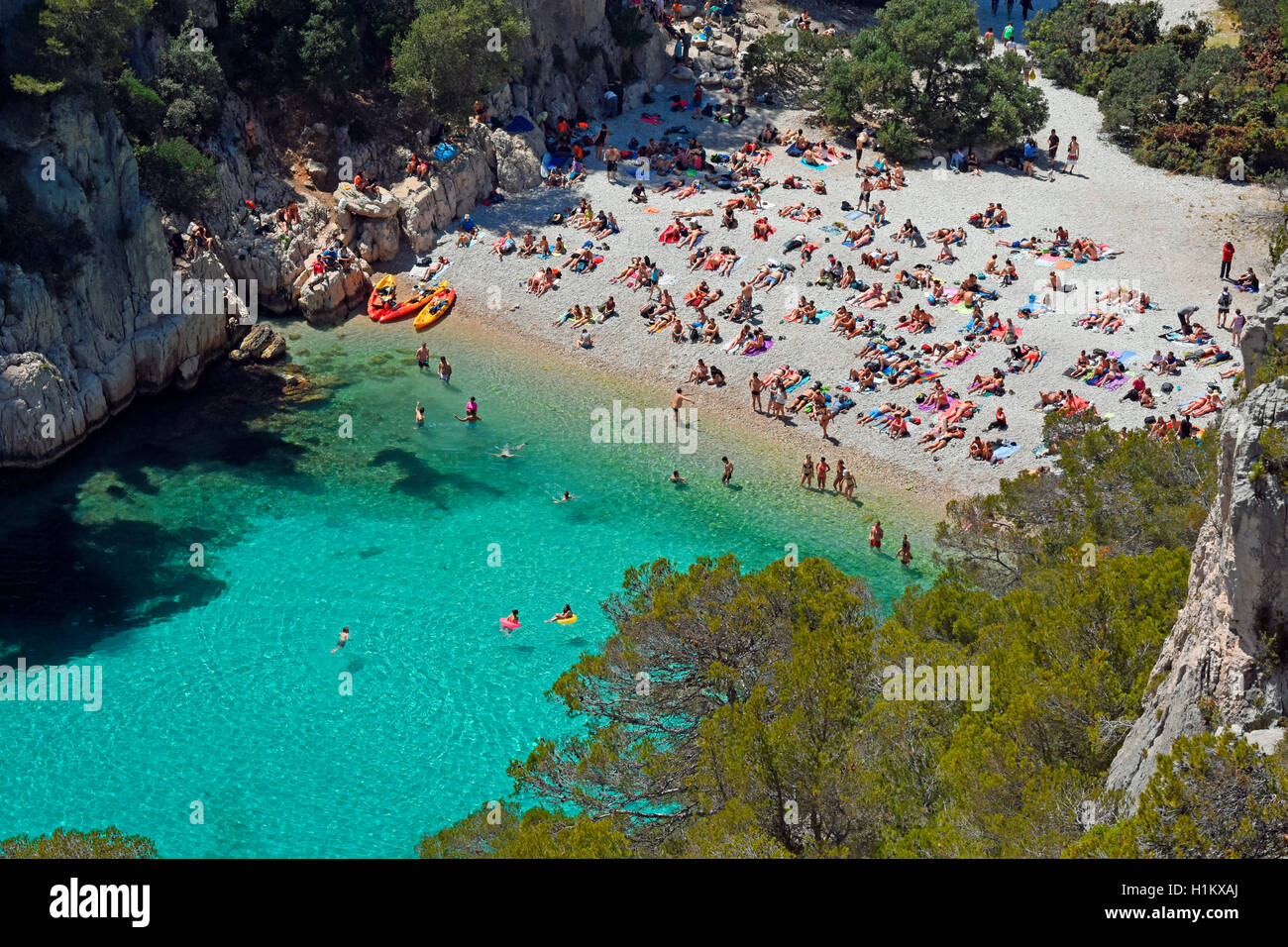 Tourists at beach with turquoise water, Calanque d'en Vau, Calanques ...