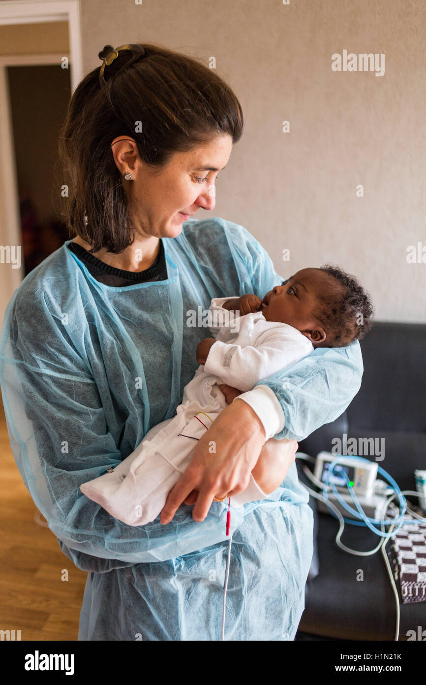 Nurse home visit from a baby born premature, Home medical care department of Limoges hospital, France. Stock Photo