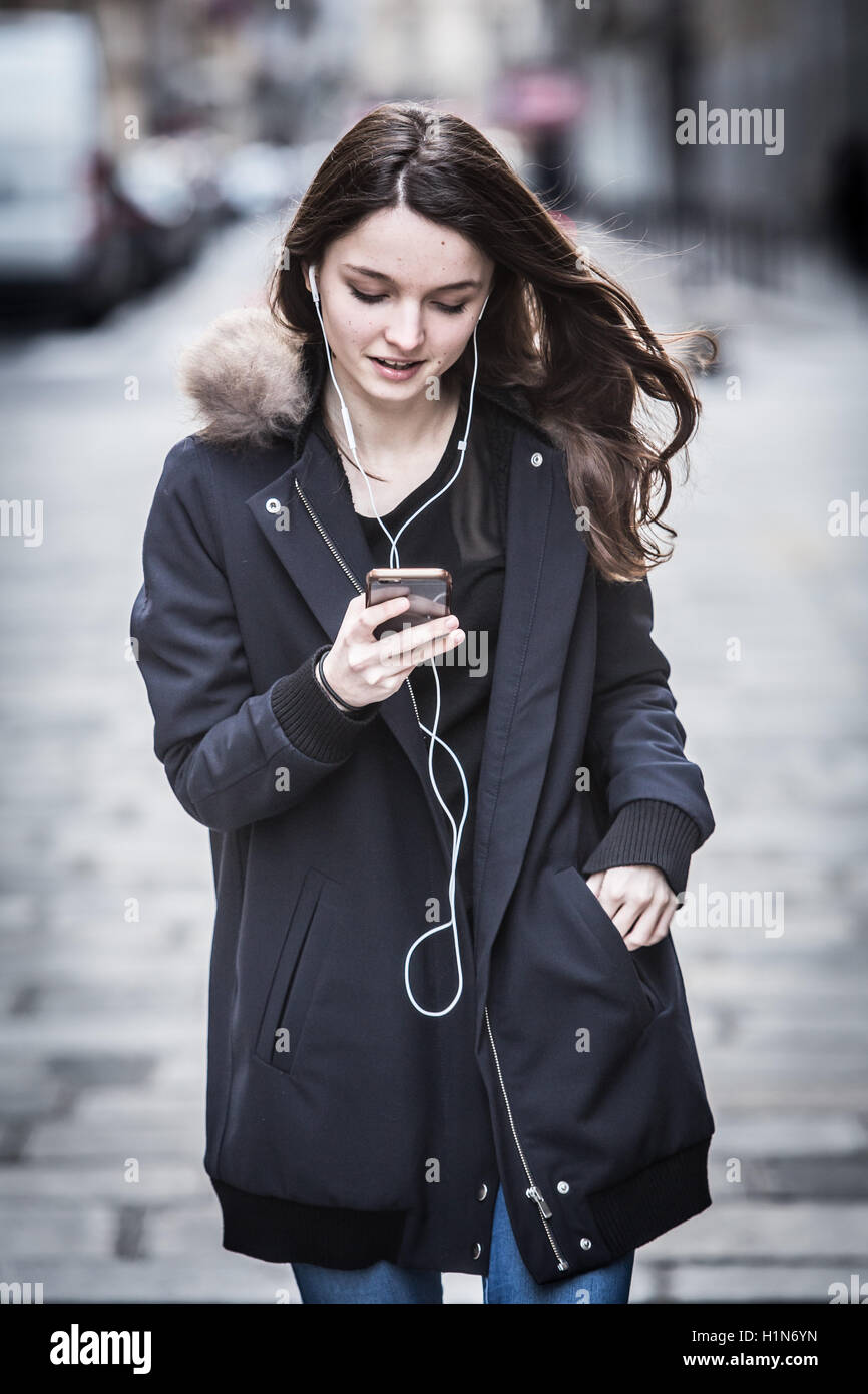 Teenage girl using a cell phone. Stock Photo