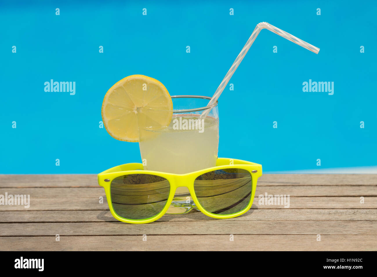 Glass of lemonade and sunglasses on the table Stock Photo Alamy