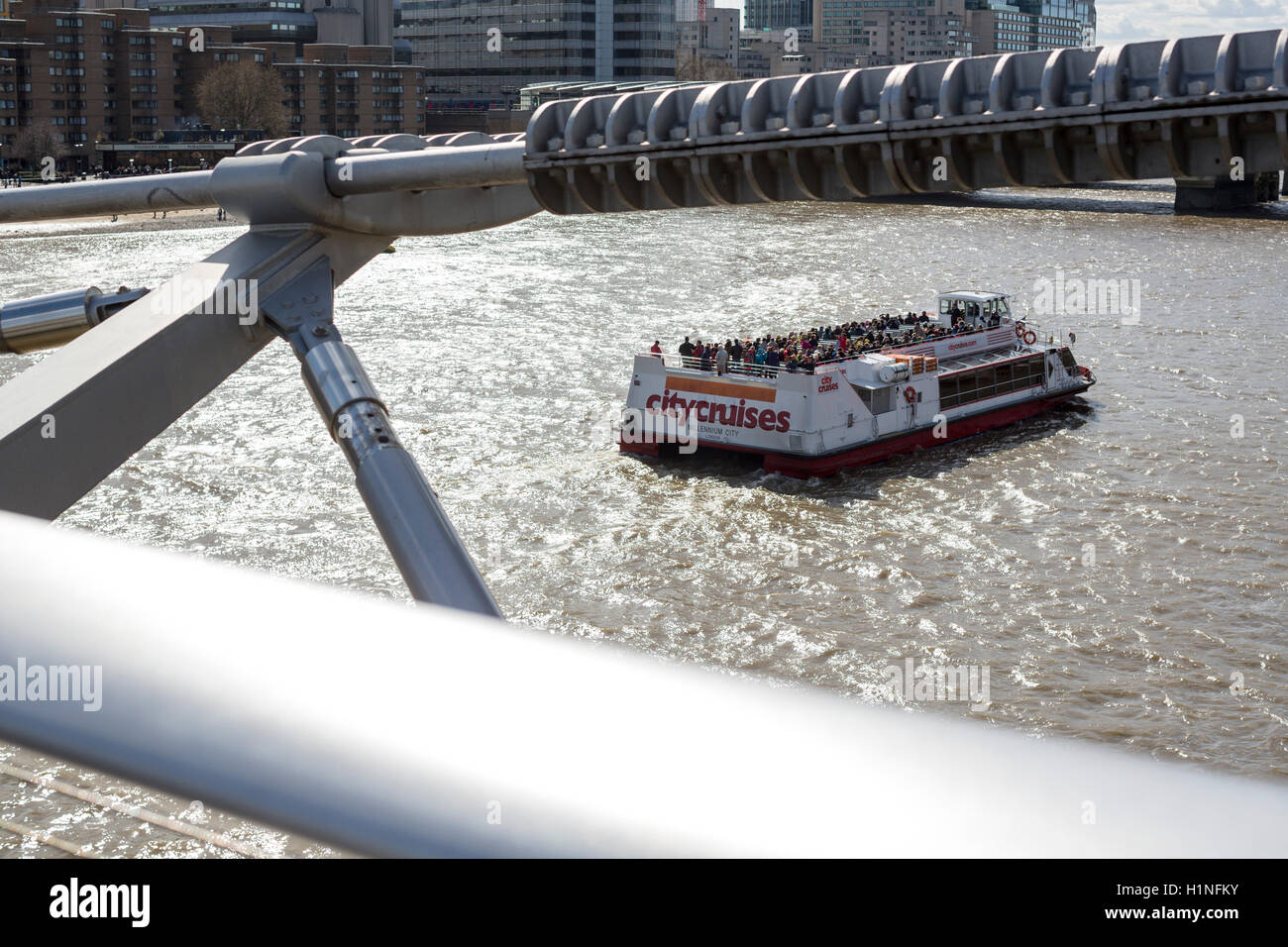 London city toursit boat seen from the millenium bridge. Stock Photo