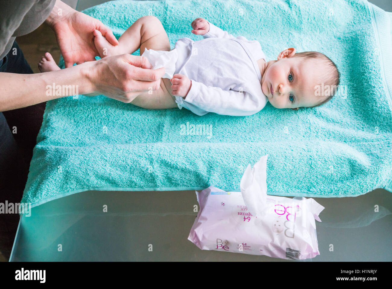 Using wipes for washing a 3 month old baby girl Stock Photo Alamy
