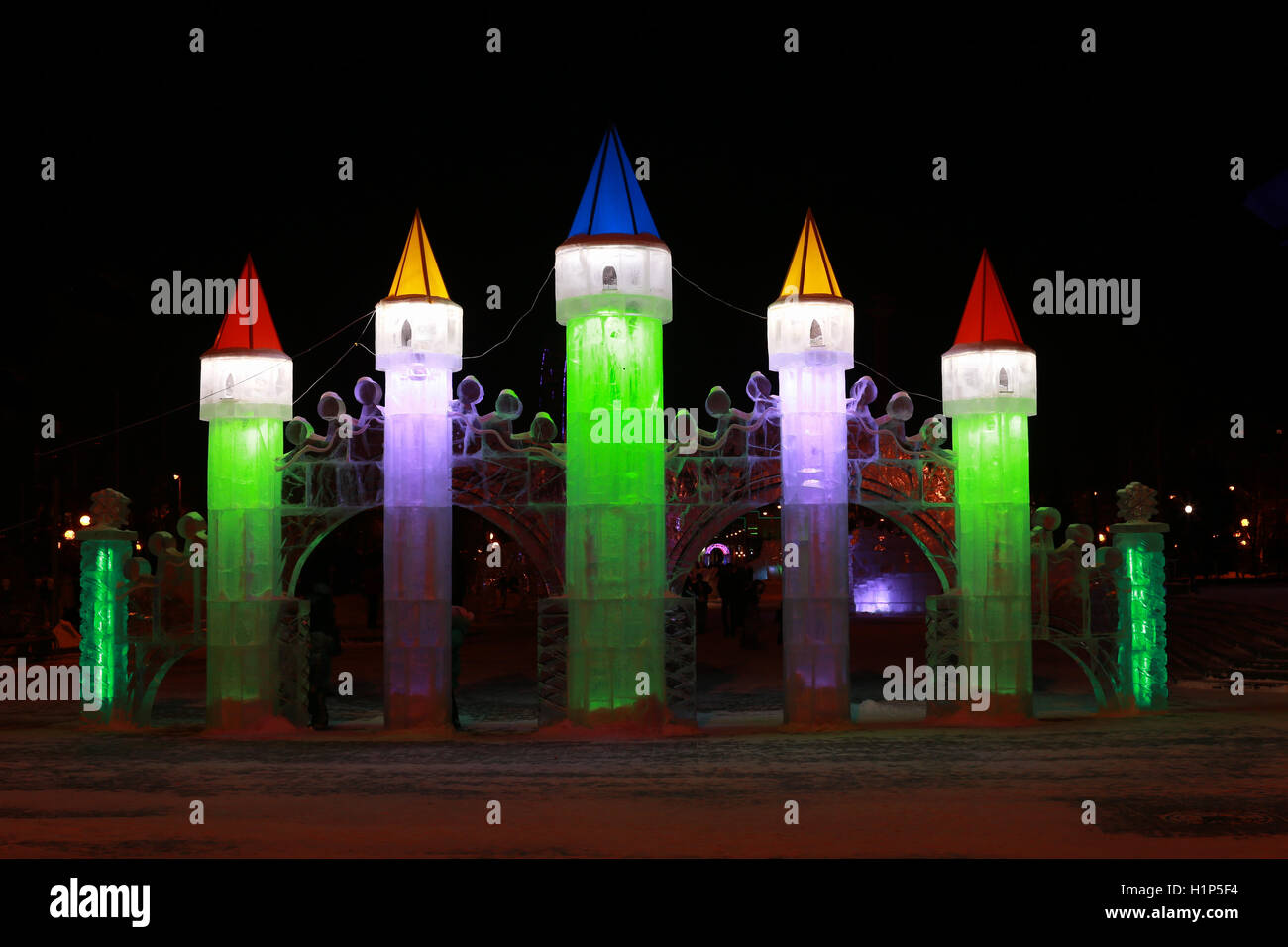 Christmas sculpture made of ice. Multi-colored towers the castle Stock ...