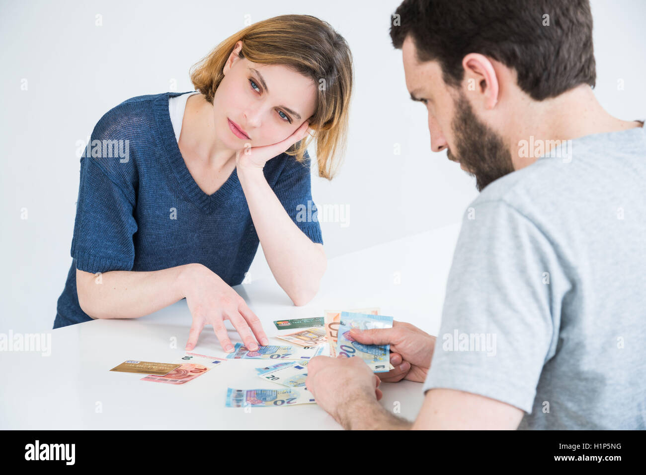 Couple and money Stock Photo - Alamy