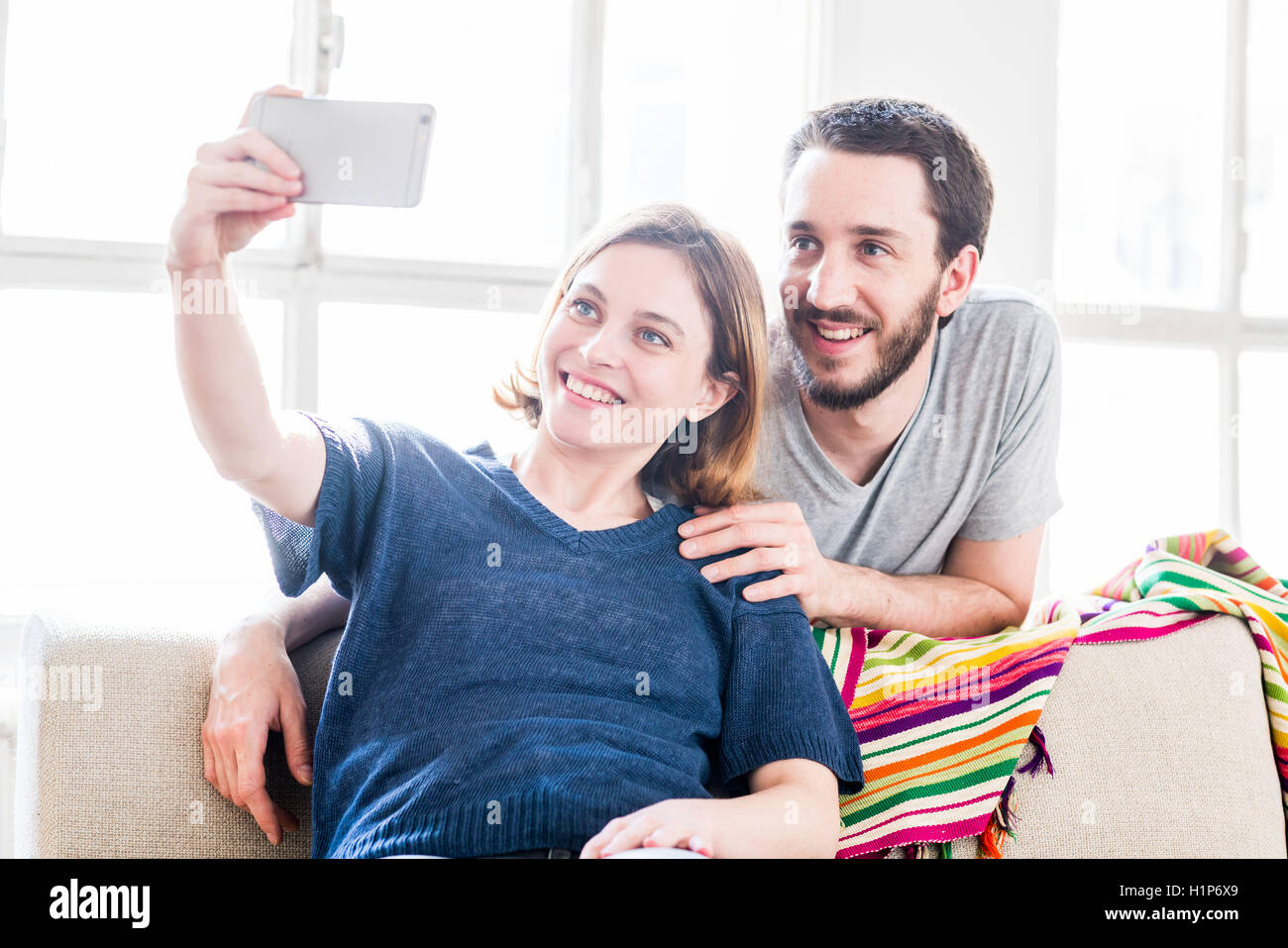 Couple taking picture with camera phone. Stock Photo