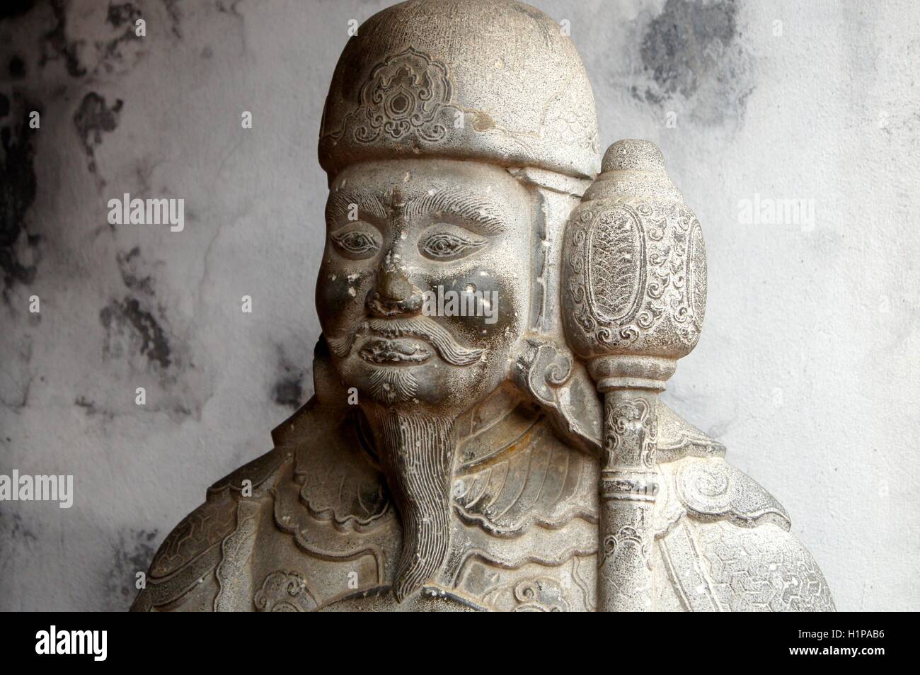 Guard statue at the Temple of Literature in Hanoi, Vietnam Stock Photo