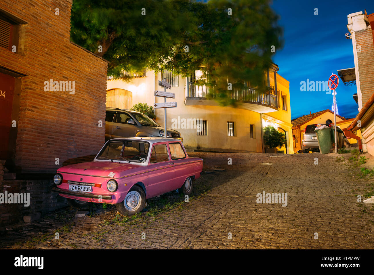 Tbilisi, Georgia - May 19, 2016: The Parked Rarity Tuning Pink Minicar ZAZ-968M Zaporozhets On The Street Paved By The Cobblesto Stock Photo