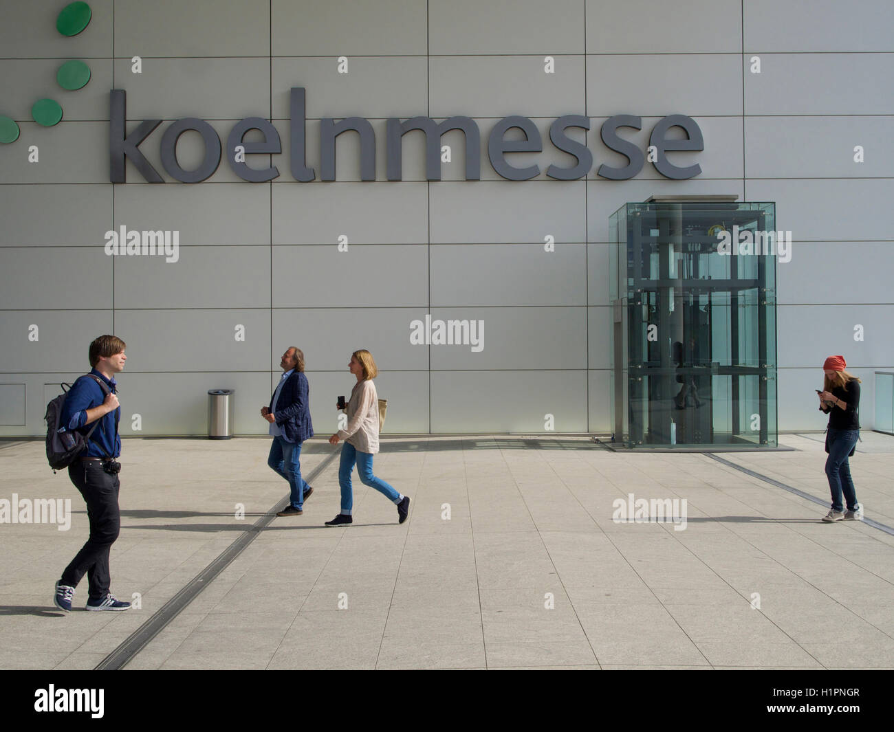 Koeln Messe entrance name sign with people in Cologne, Germany Stock Photo