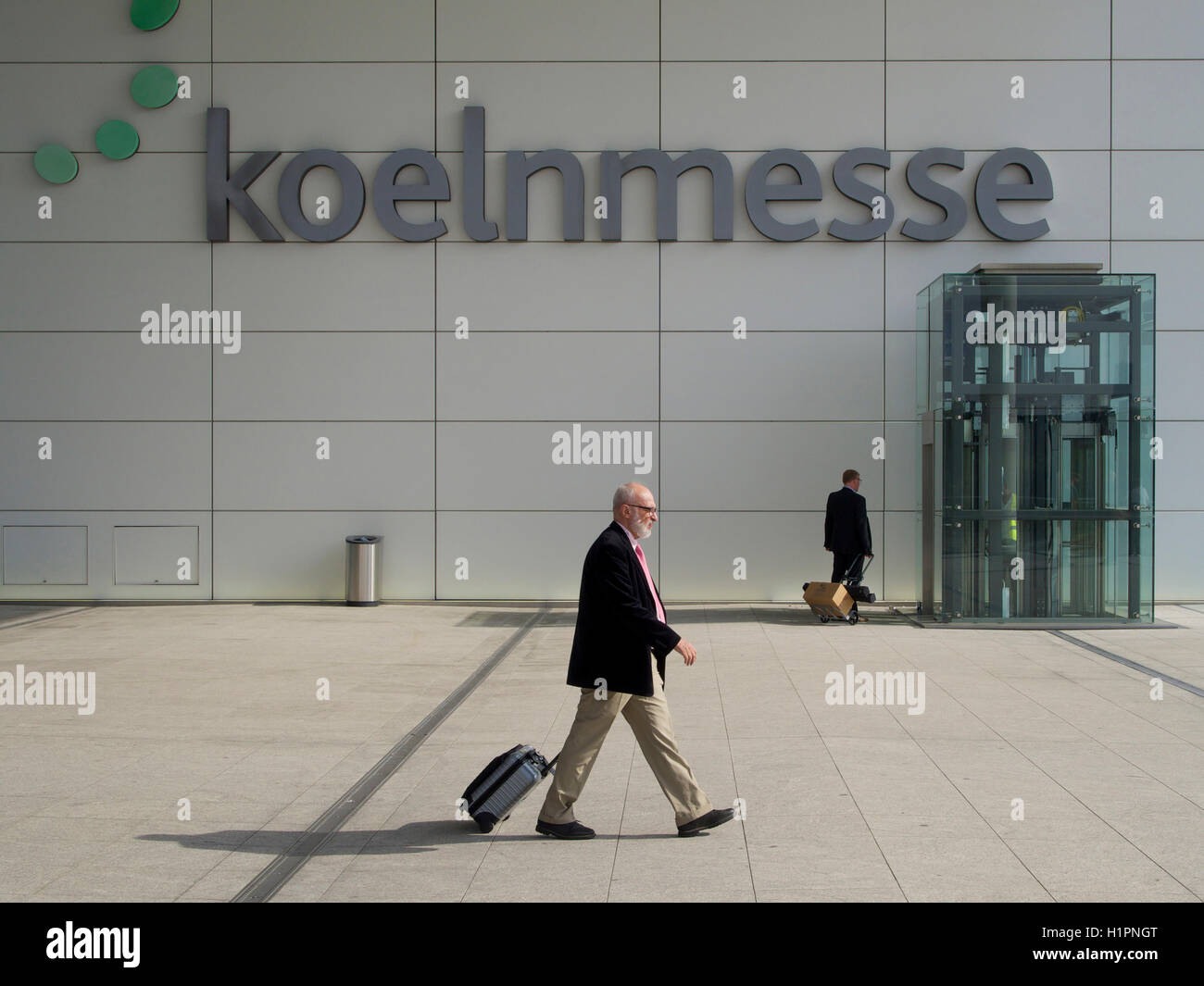 Koeln Messe entrance name sign with people in Cologne, Germany Stock Photo