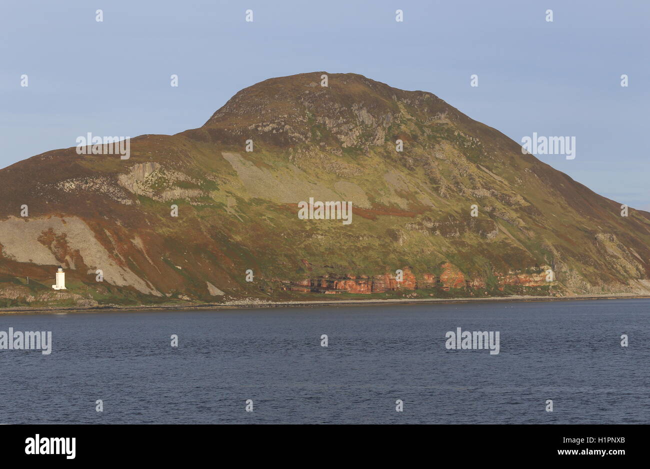 Outer or Pillar Rock lighthouse and east coast of Holy Isle Scotland  September 2016 Stock Photo