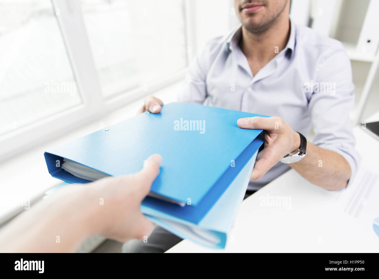 Man Hand File Folder close up of businessman taking folders from hand Stock Photo - Alamy