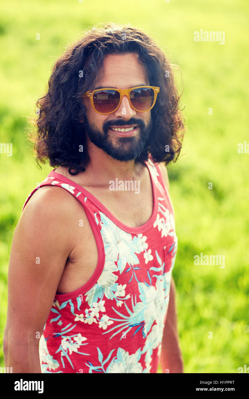 Smiling Young Hippie Man On Green Field Stock Photo By