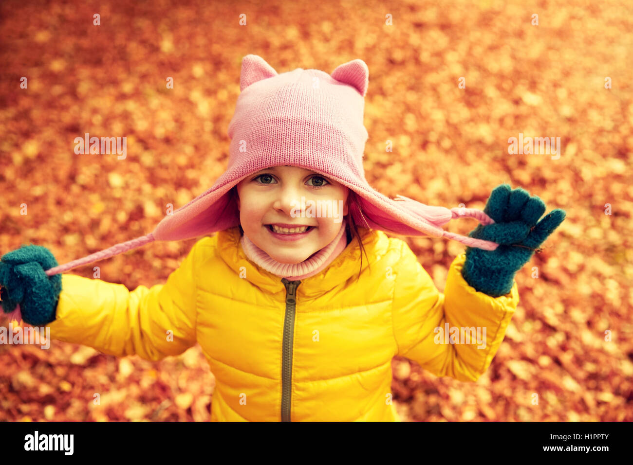 happy little girl in autumn park Stock Photo - Alamy